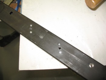 Seat belt mounting holes drilled