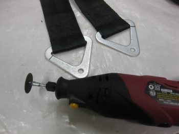 Seatbelt strap brackets marked for cutting