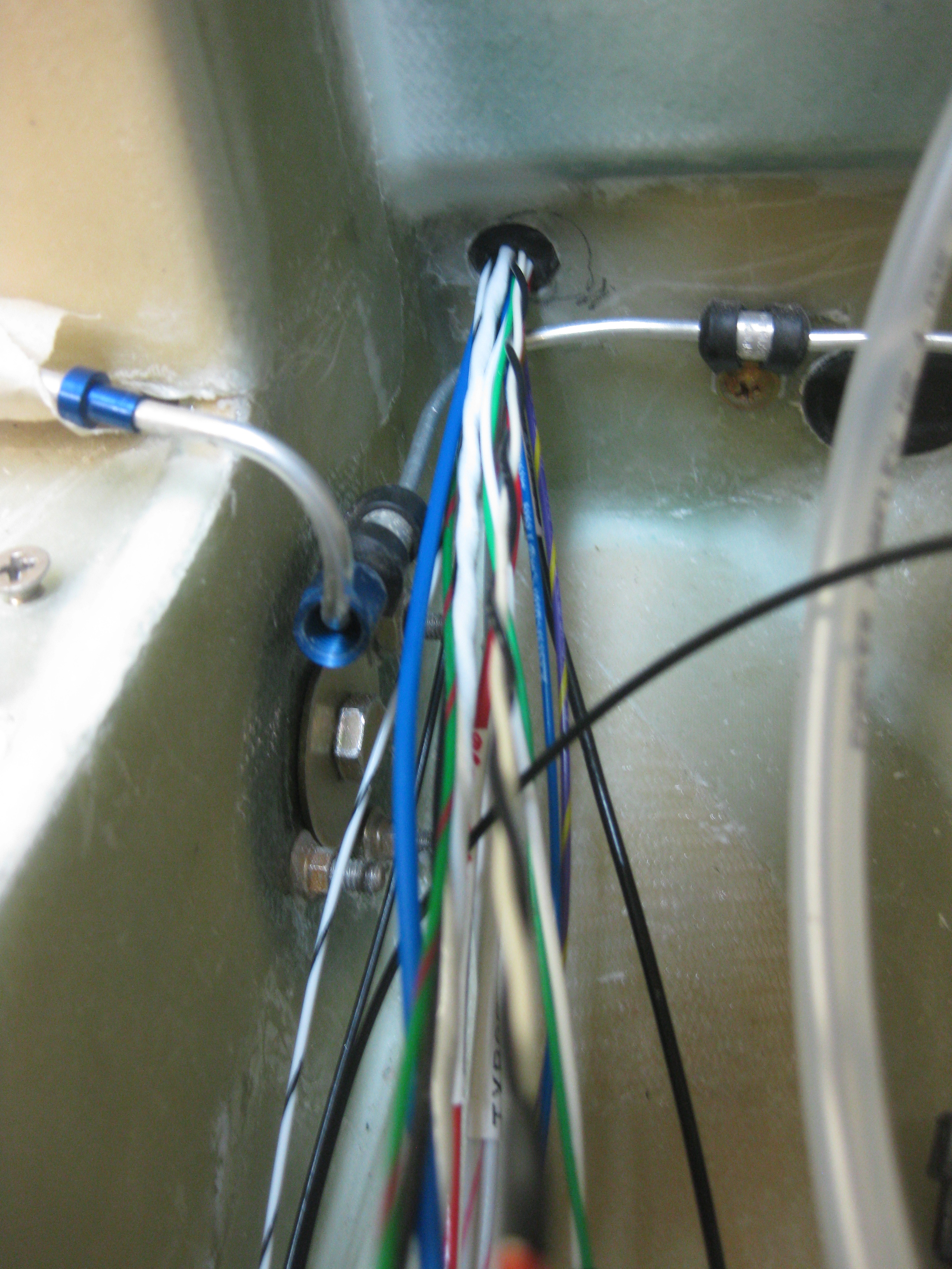 Aft side Napster BH wires thru hole and grommet A Long EZ Push